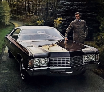 His car is by Chevrolet. His suit is from Sears. motor meme